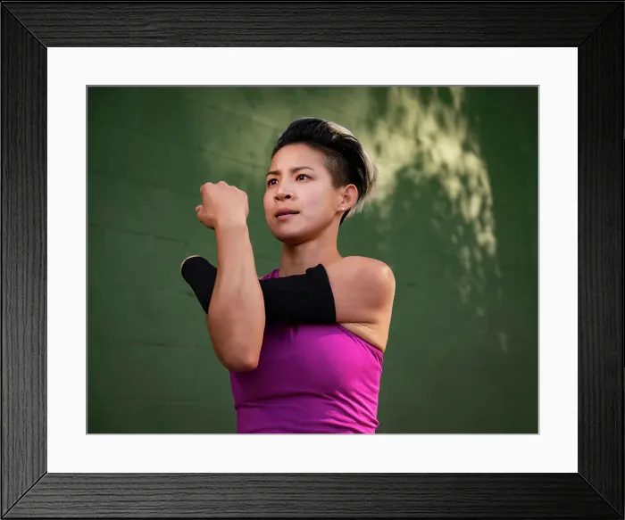 Framed Print : Athletic woman with amputated hand stretching arm Framed Print : Athletic woman with amputated hand stretching arm