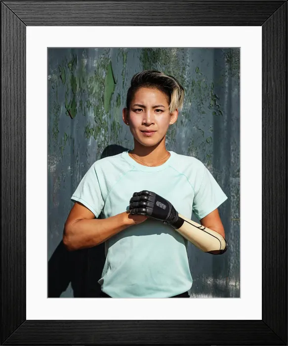 Framed Print : Portrait of athlete woman with prosthetic arm Framed Print : Portrait of athlete woman with prosthetic arm