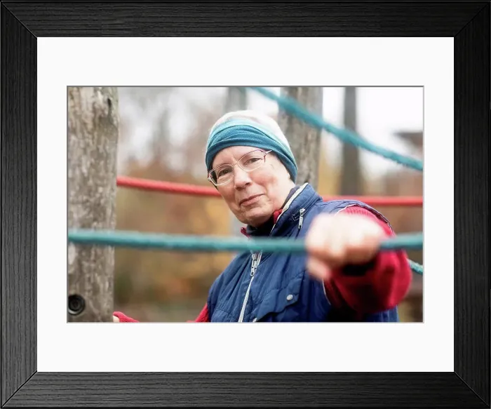 Framed Print : Senior woman exercising in park