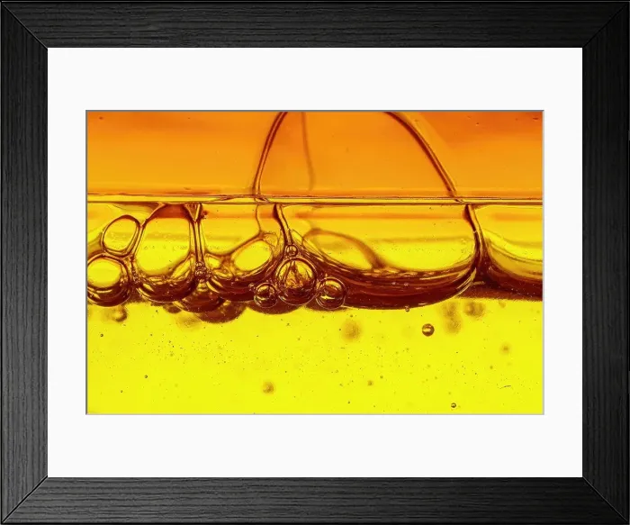 Framed Print : A viscous yellow liquid with air bubbles Framed Print : A viscous yellow liquid with air bubbles