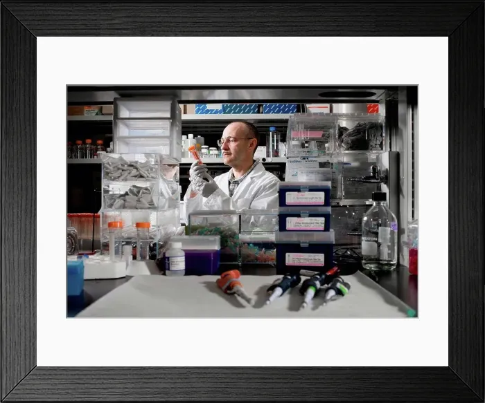 Framed Print : Scientist experimenting in laboratory Framed Print : Scientist experimenting in laboratory