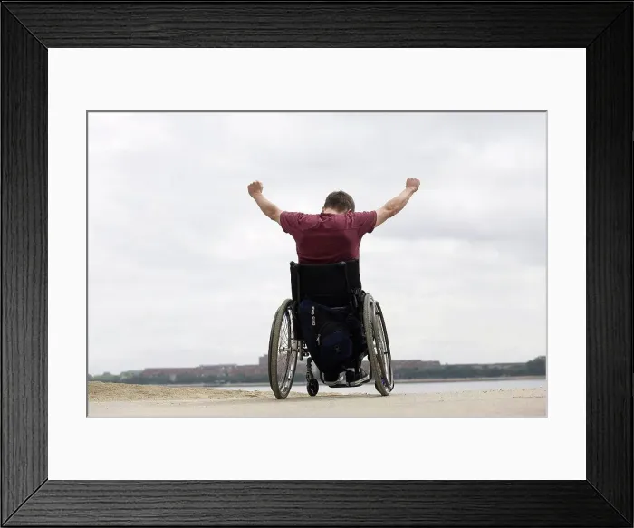 Framed Print : Handicapped man on a wheel chair Framed Print : Handicapped man on a wheel chair