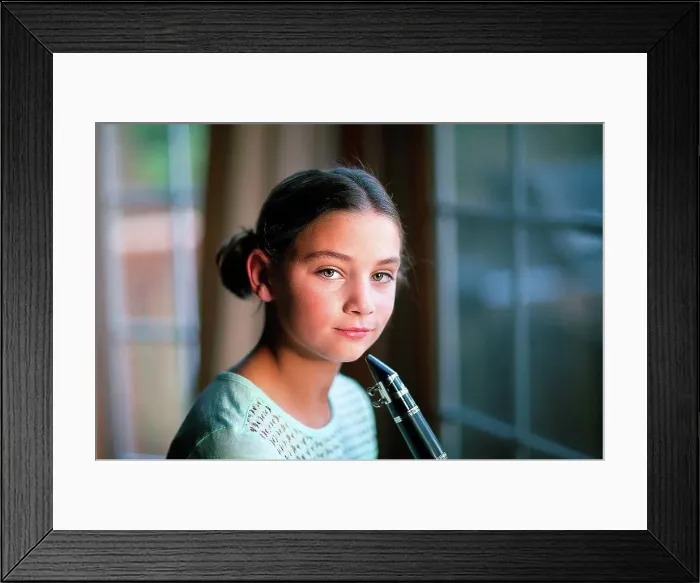 Framed Print : Young clarinettist posing with her clarinet Framed Print : Young clarinettist posing with her clarinet