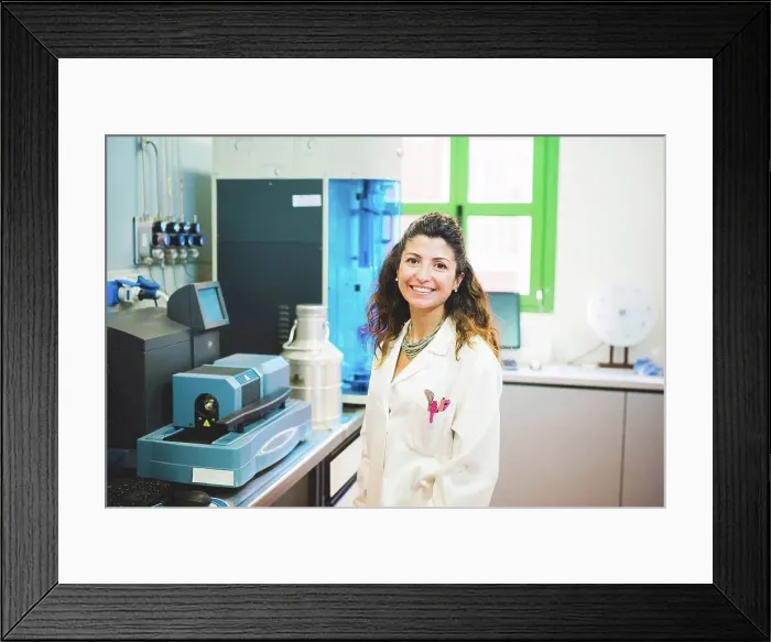 Framed Print : Female scientist and Thermogravimetric / Differential Thermal Analyzer