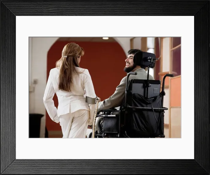 Framed Print : Man with Cerebral Palsy and woman with cane conversing Framed Print : Man with Cerebral Palsy and woman with cane conversing