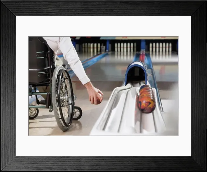 Framed Print : Low section view of a man with a Spinal Cord Injury playing ten pin bowling Framed Print : Low section view of a man with a Spinal Cord Injury playing ten pin bowling