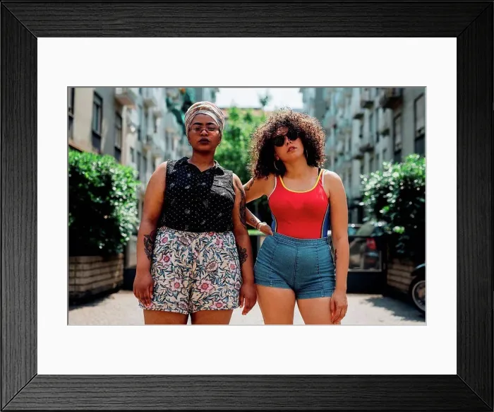 Framed Print : Young women posing on walkway Framed Print : Young women posing on walkway