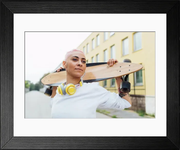 Framed Print : Confident portrait of a skateboarder Framed Print : Confident portrait of a skateboarder