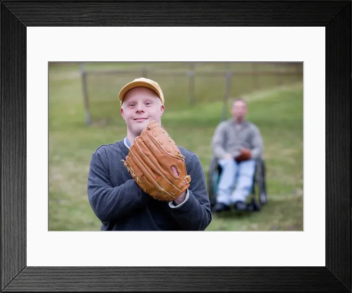 Framed Print : Man with Down Syndrome wearing a baseball glove Framed Print : Man with Down Syndrome wearing a baseball glove