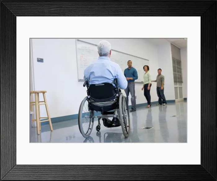 Framed Print : University professor with Muscular Dystrophy with his students in a classroom Framed Print : University professor with Muscular Dystrophy with his students in a classroom
