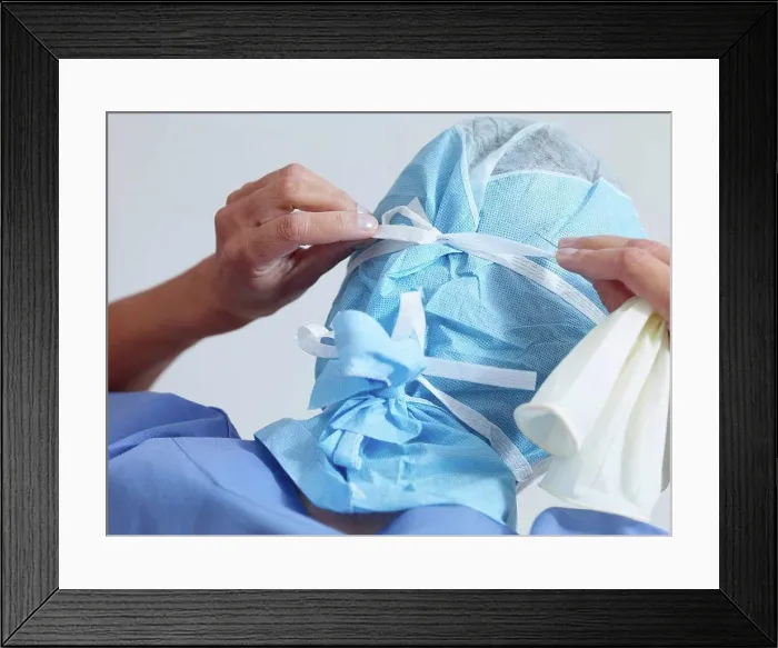 Framed Print : Surgeon putting on surgical mask Framed Print : Surgeon putting on surgical mask