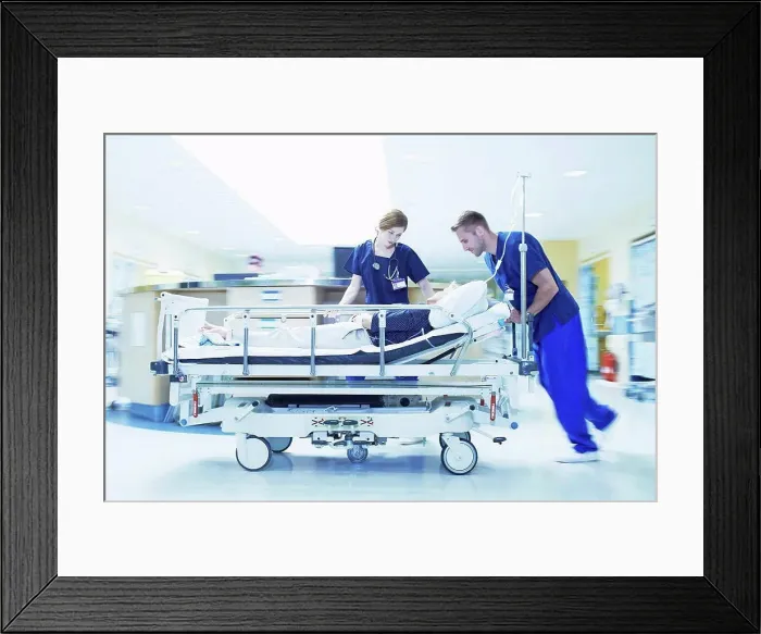 Framed Print : Two medics pushing gurney in hospital emergency room Framed Print : Two medics pushing gurney in hospital emergency room