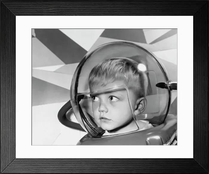 Framed Print : Close-up of a boy wearing a space helmet