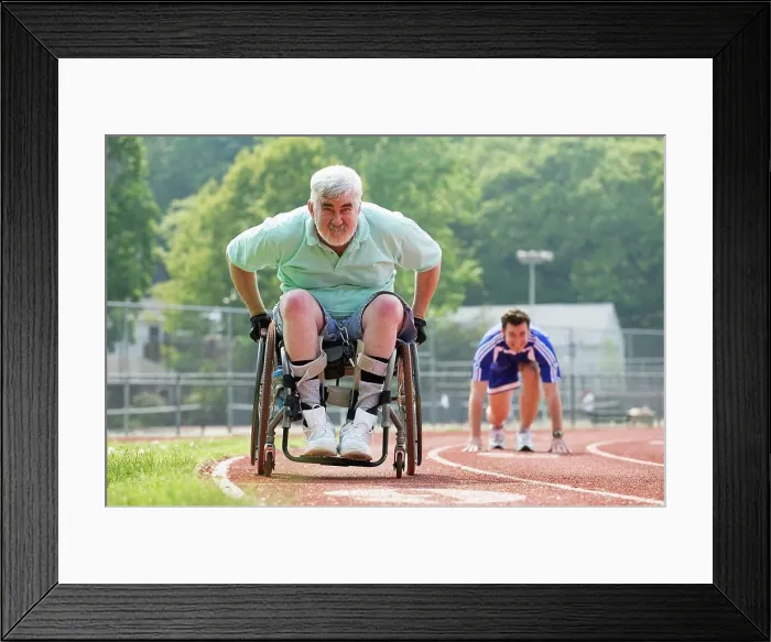 Framed Print : Young man racing with a senior man with Muscular Dystrophy on a racetrack Framed Print : Young man racing with a senior man with Muscular Dystrophy on a racetrack