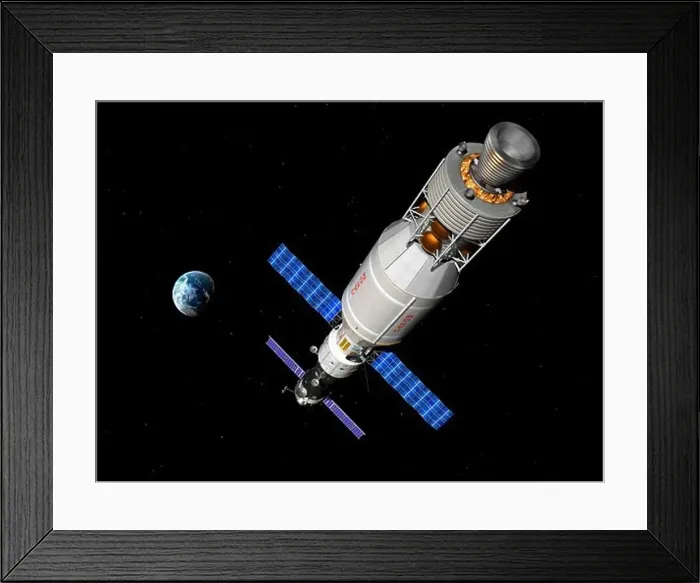 Framed Print : A manned Soyuz TMA-M spacecraft docked with an extended stay module Framed Print : A manned Soyuz TMA-M spacecraft docked with an extended stay module