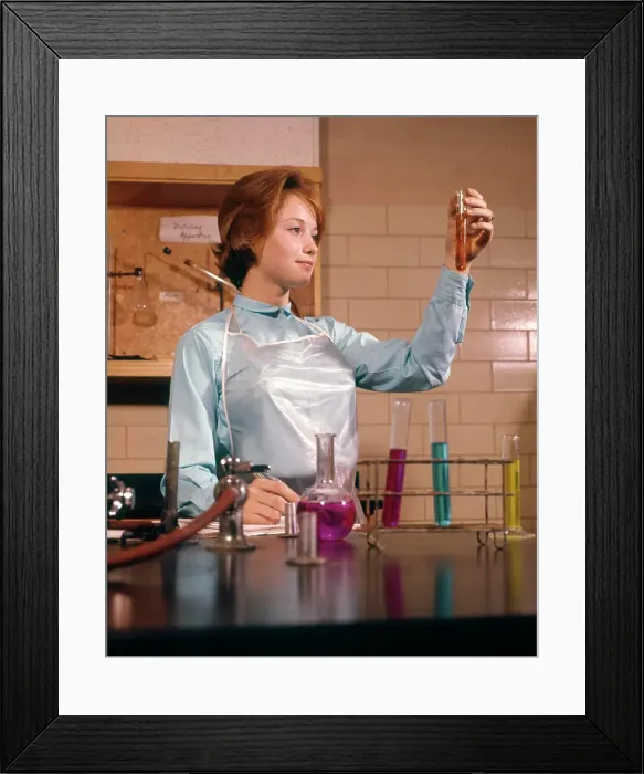 Framed Print : 1960s COED FEMALE STUDENT CHEMISTRY LAB LABORATORY LOOKING AT TEST TUBE SCIENCE EDUCATION Framed Print : 1960s COED FEMALE STUDENT CHEMISTRY LAB LABORATORY LOOKING AT TEST TUBE SCIENCE EDUCATION