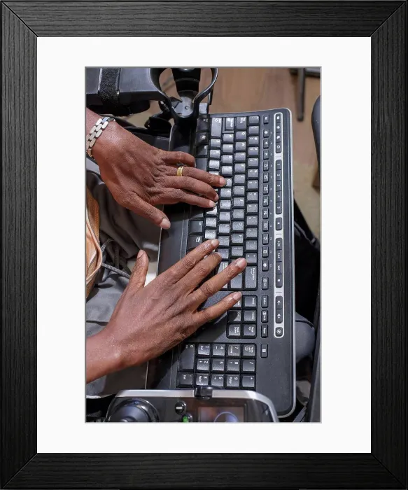 Framed Print : Man with Guillain-Barre Syndrome using his computer to communicate in his power chair Framed Print : Man with Guillain-Barre Syndrome using his computer to communicate in his power chair