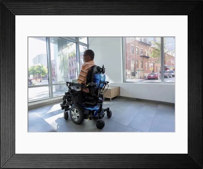 Framed Print : Man with Guillain-Barre Syndrome on wheelchair looking out through the apartment window Framed Print : Man with Guillain-Barre Syndrome on wheelchair looking out through the apartment window