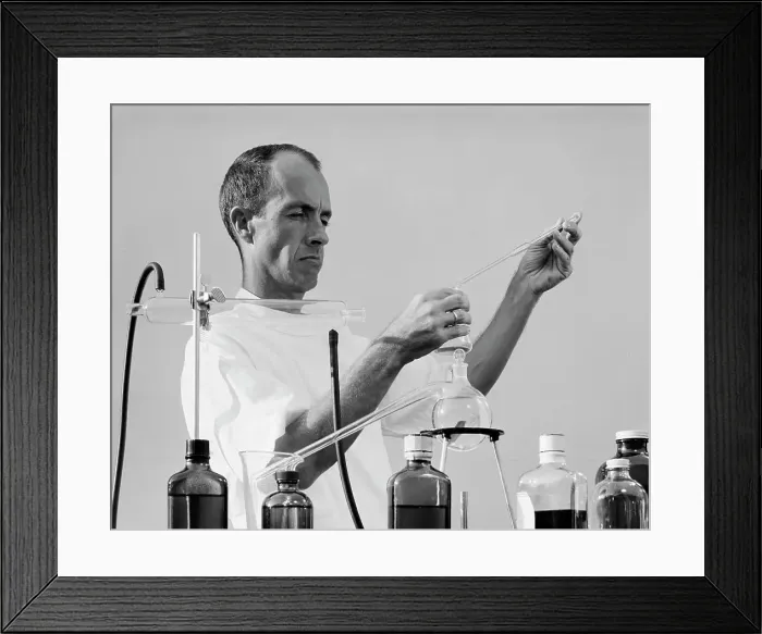 Framed Print : Scientist mixing chemicals in laboratory Framed Print : Scientist mixing chemicals in laboratory