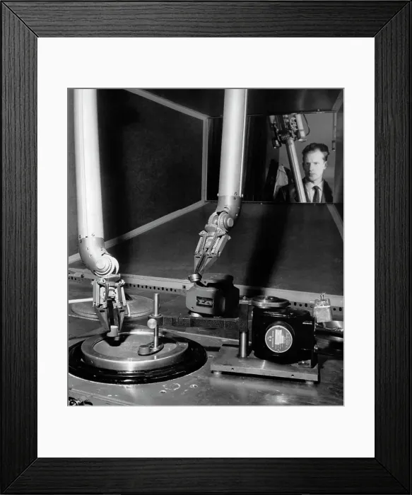 Framed Print : Scientist observing laboratory equipment in a metallurgy laboratory