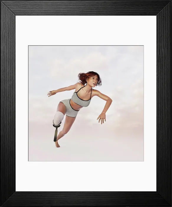 Framed Print : Woman running with artificial leg