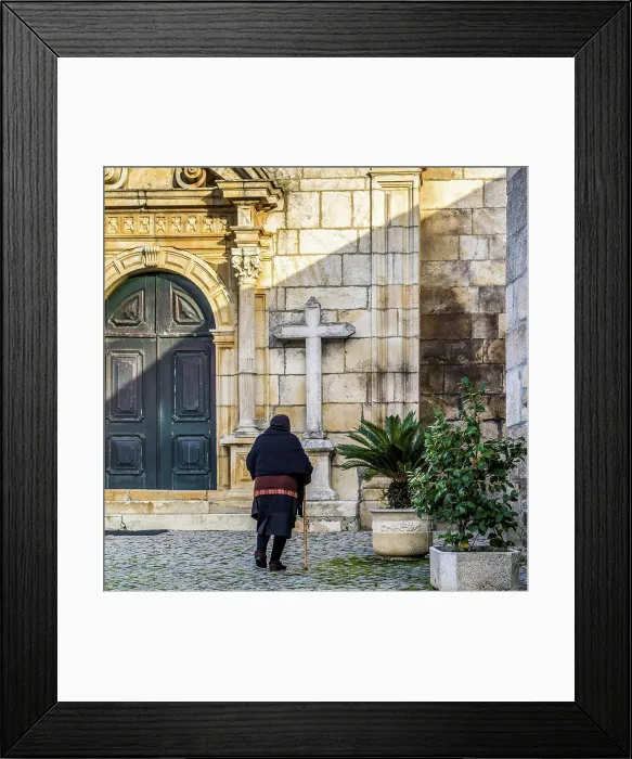 Framed Print : Senior woman approaching a church; Lamego Municipality, Viseu District, Portugal