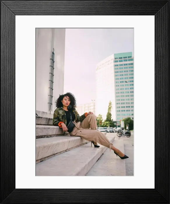 Framed Print : Portrait confident, stylish woman on urban steps Framed Print : Portrait confident, stylish woman on urban steps