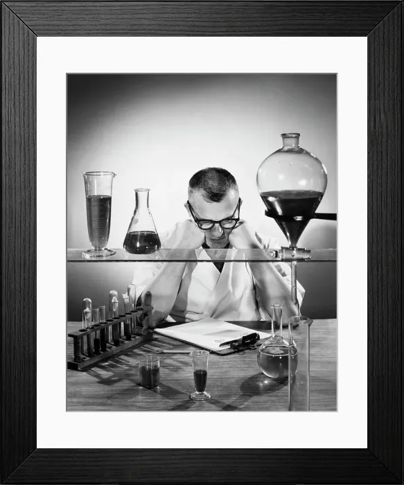 Framed Print : Scientist examining chemicals in a laboratory Framed Print : Scientist examining chemicals in a laboratory