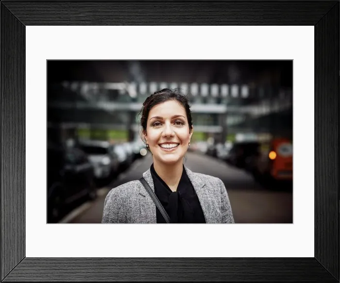 Framed Print : Portrait of smiling confident female lawyer in formals at workplace Framed Print : Portrait of smiling confident female lawyer in formals at workplace