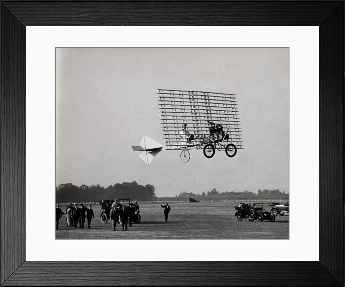 Framed Print : Low angle view of an aircraft flying over the ground