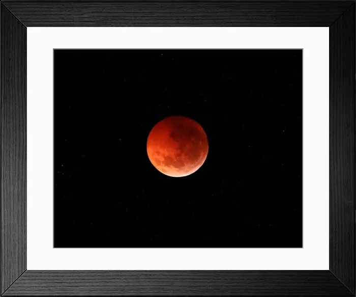 Framed Print : The totality phase of a lunar eclipse during the 2010 solstice Framed Print : The totality phase of a lunar eclipse during the 2010 solstice