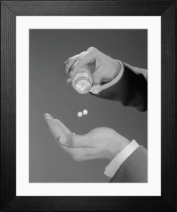 Framed Print : 1960S Male Hands Shaking Two Aspirins Pills From Bottle Framed Print : 1960S Male Hands Shaking Two Aspirins Pills From Bottle