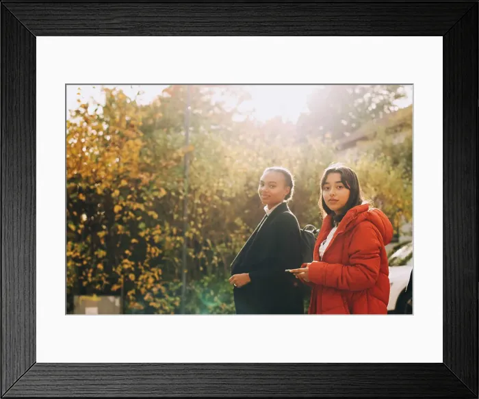 Framed Print : Portrait of teenage girls in jacket against trees during autumn Framed Print : Portrait of teenage girls in jacket against trees during autumn
