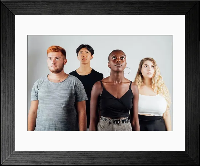 Framed Print : Four young men and women, looking up Framed Print : Four young men and women, looking up