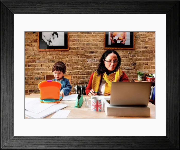 Framed Print : Toddler boy learning from mother working from home
