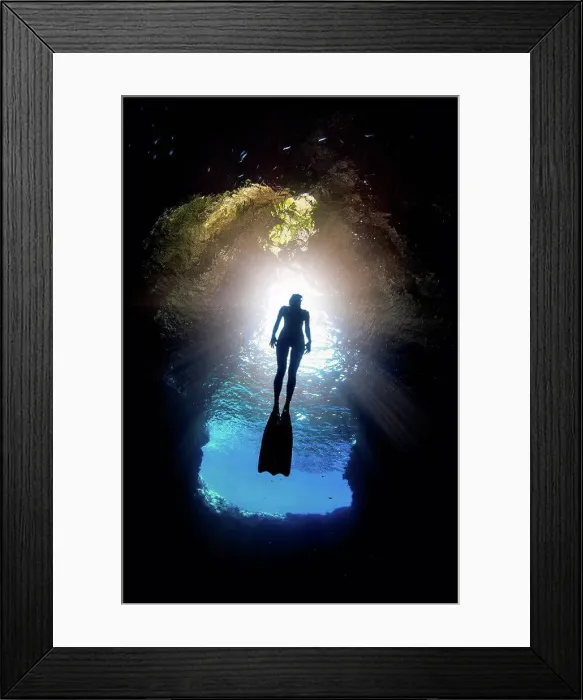 Framed Print : Woman free-diving, low angle view, Swallow Cave, Vavau, Tonga, Fiji Framed Print : Woman free-diving, low angle view, Swallow Cave, Vavau, Tonga, Fiji