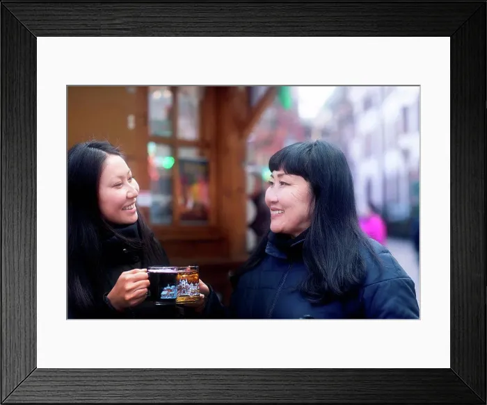 Framed Print : Mother and daughter drinking at Christmas market, Freiburg, Baden-Wurttemberg, Germany Framed Print : Mother and daughter drinking at Christmas market, Freiburg, Baden-Wurttemberg, Germany