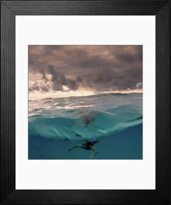 Framed Print : Young boy swimming underwater, split view, Tonga