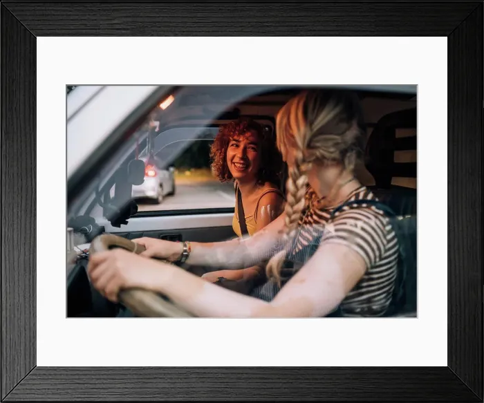Framed Print : Happy female couple in van Framed Print : Happy female couple in van