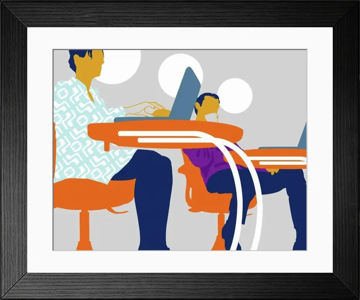 Framed Print : Businessman and businesswoman using laptops at classroom desks Framed Print : Businessman and businesswoman using laptops at classroom desks