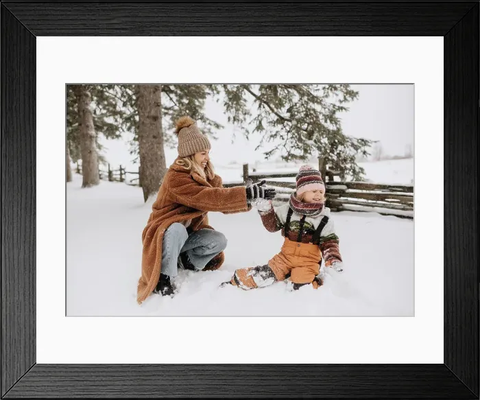 Framed Print : Canada, Ontario, Mother and daughter playing in snow Framed Print : Canada, Ontario, Mother and daughter playing in snow