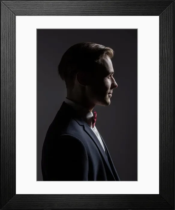 Framed Print : Profile portrait handsome young man in suit with bow tie Framed Print : Profile portrait handsome young man in suit with bow tie