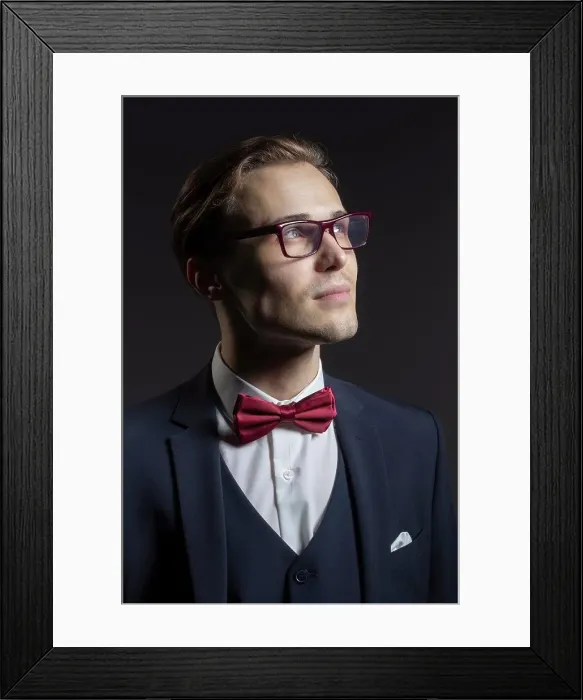 Framed Print : Portrait thoughtful, handsome young man in suit and eyeglasses