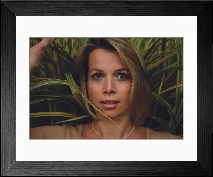 Framed Print : Beautiful blond woman in front of green grass Framed Print : Beautiful blond woman in front of green grass
