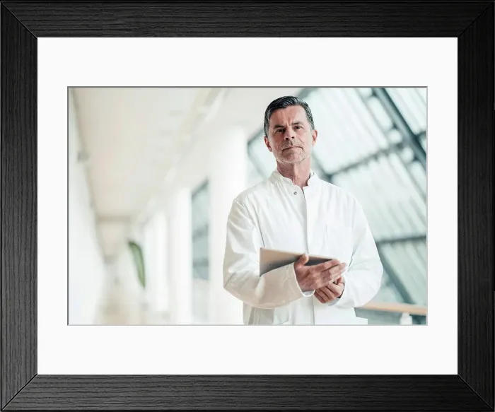 Framed Print : Confident scientist with tablet PC at office