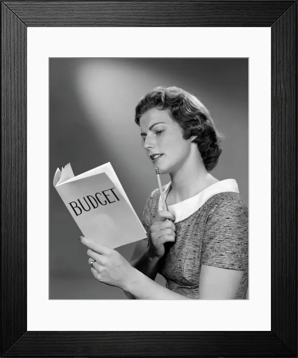 Framed Print : 1940S Woman Holding Budget Book With Pencil To Chin Framed Print : 1940S Woman Holding Budget Book With Pencil To Chin