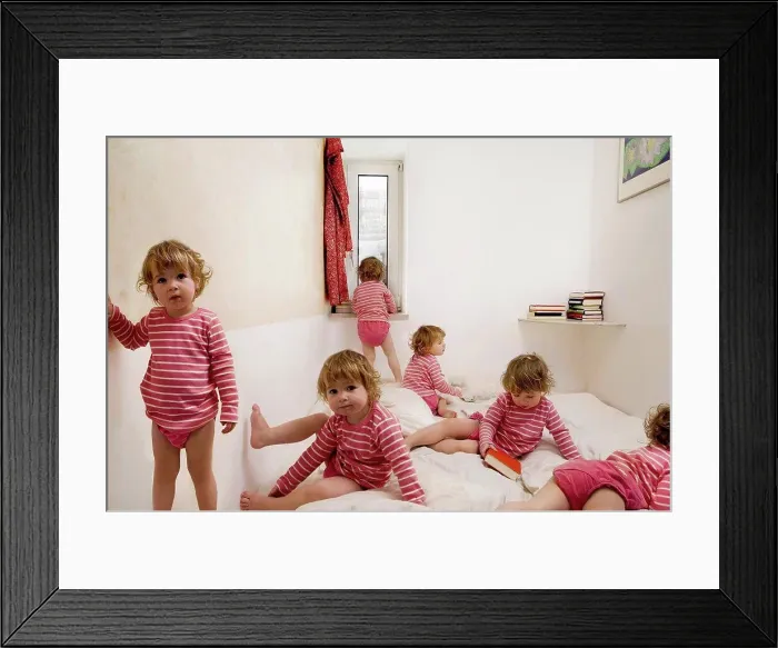 Framed Print : Child crawls across bed Framed Print : Child crawls across bed