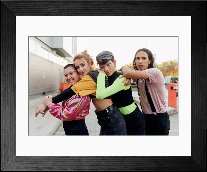 Framed Print : Friends standing in line on footpath Framed Print : Friends standing in line on footpath