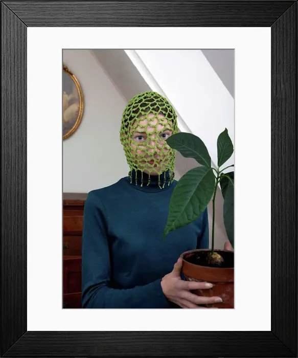 Framed Print : Portrait of teenage girl wearing crocheted green headdress holding potted avocado plant Framed Print : Portrait of teenage girl wearing crocheted green headdress holding potted avocado plant