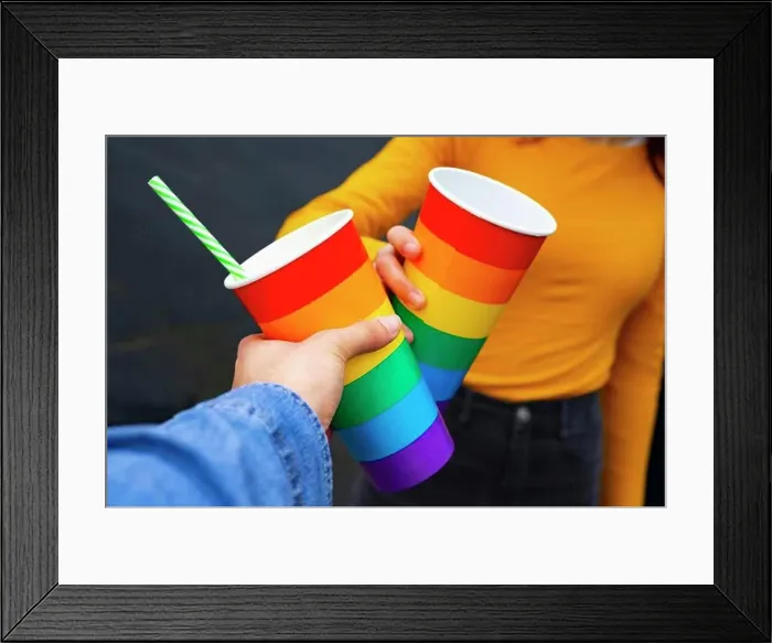 Framed Print : Hands toasting with rainbow pride cups at a party Framed Print : Hands toasting with rainbow pride cups at a party